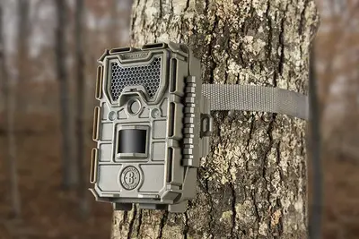 Bushnell 16MP Trophy Cam HD Essential E3 Trail Camera mounted on tree